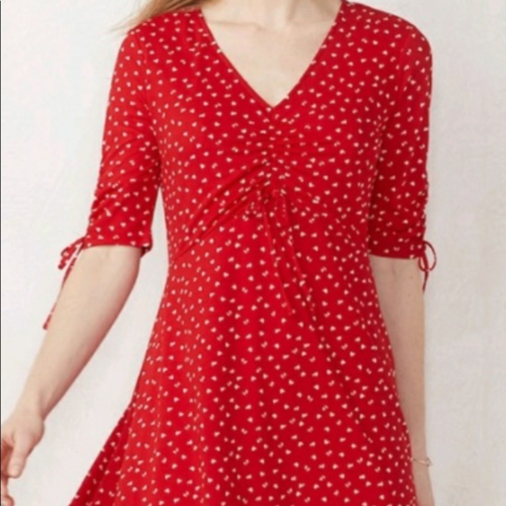 Red dress, elbow length sleeves, white hearts